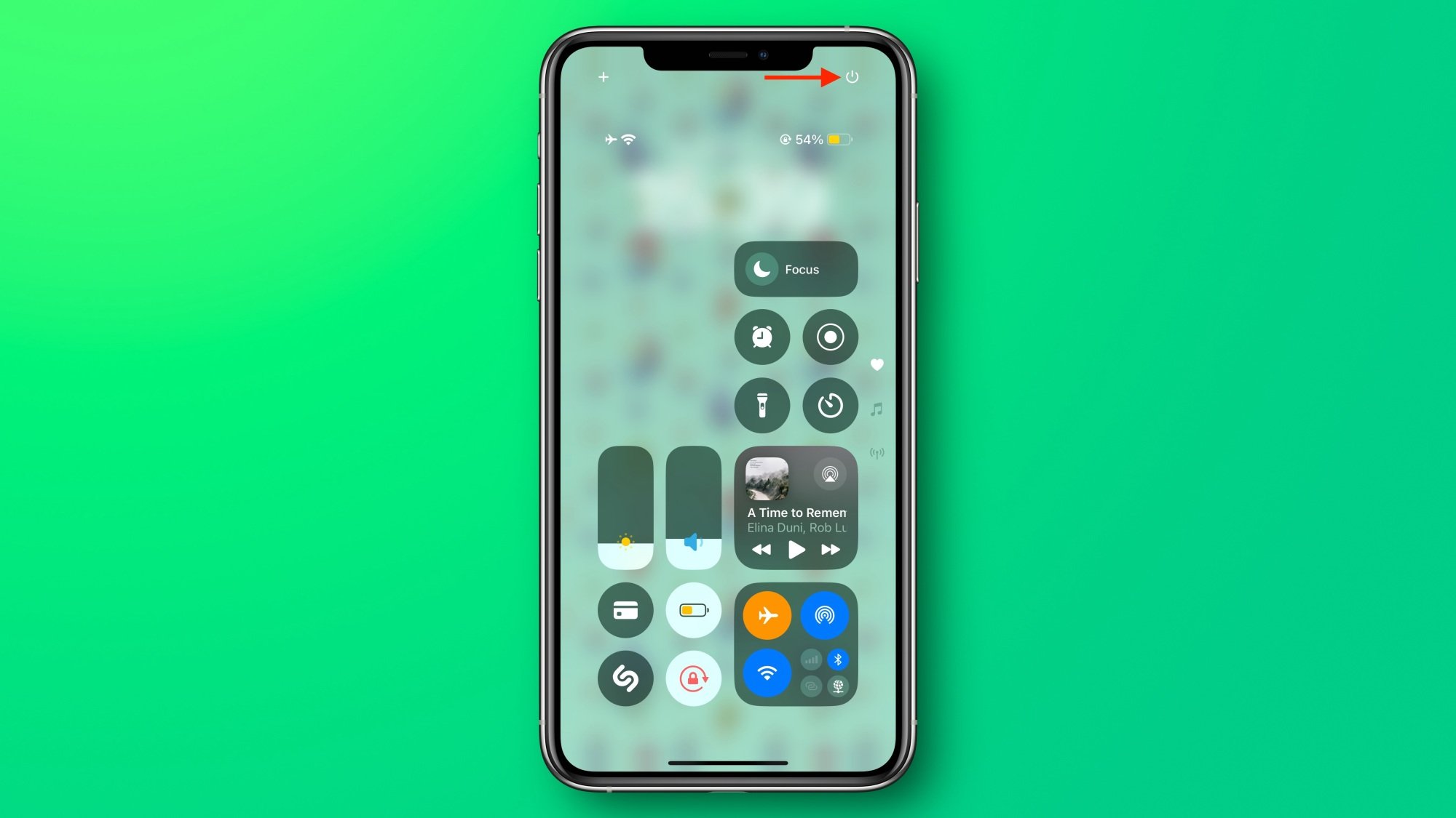 The iOS 18 Control Center with the power button marked with an arrow.