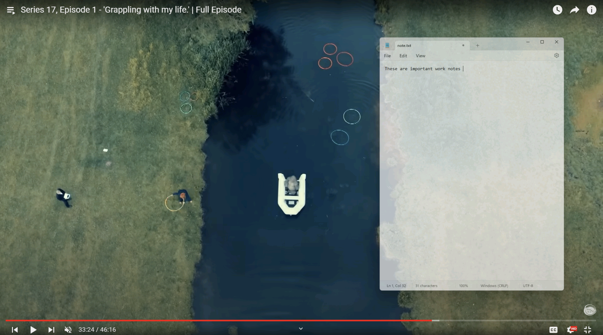 An overhead view of a gorilla in a boat on an English river is shown—a clip from the current season of Taskmaster. A transparent Notepad window, shown over it, says These are important work notes. 