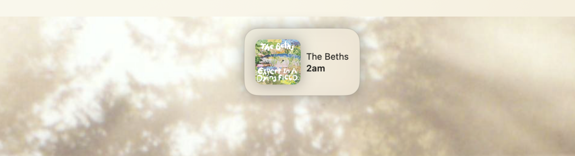 A simple overlay showing the currently playing track (2am by The Beths)