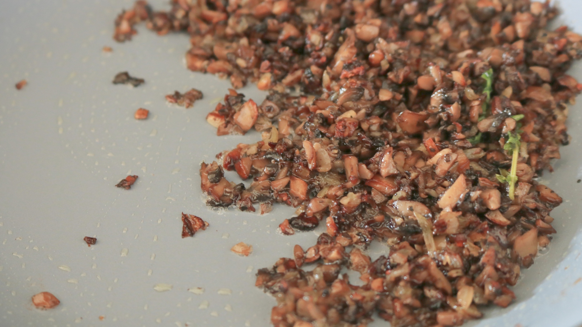 Mushroom duxelles in a pan.