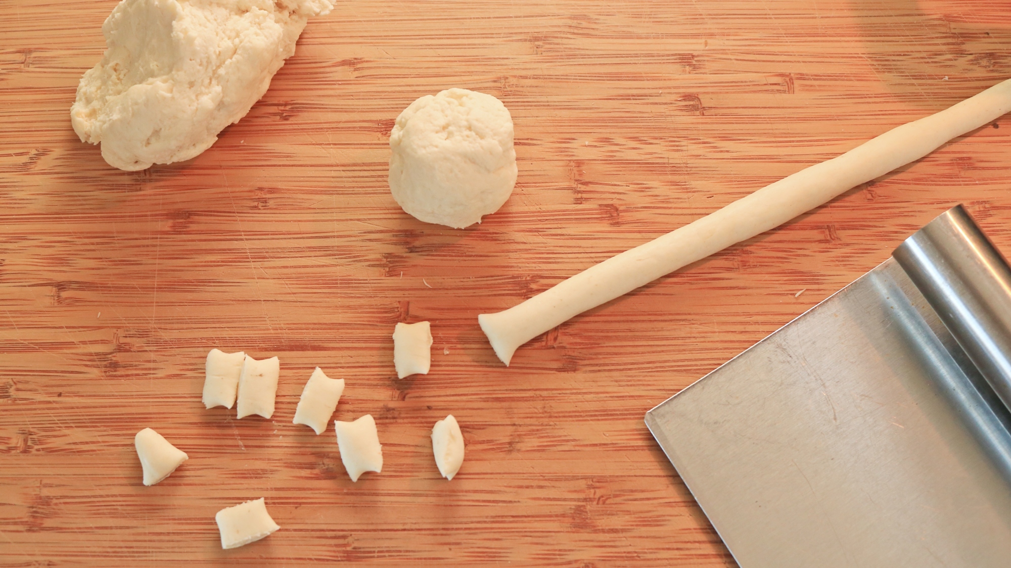 Dough shaped into a long rope and cut into gnocchetti.