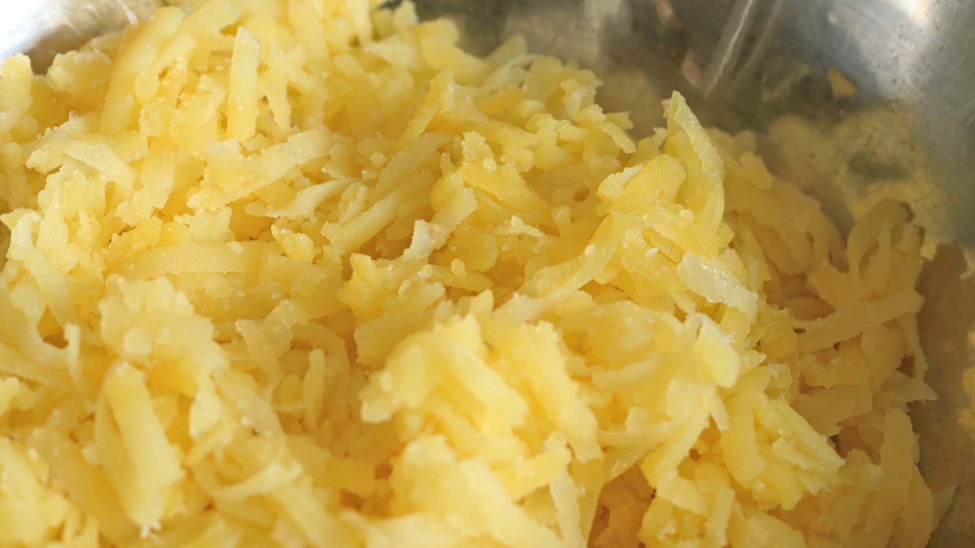 Shredded potatoes in a bowl